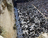 Orthodox Jews attend a blessing ceremony at the wall in 2003