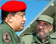 Chavez (L) accuses the US ofbacking plots to topple him
