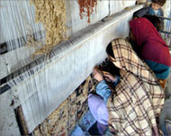 Some women feed their children opium so they can weave carpets