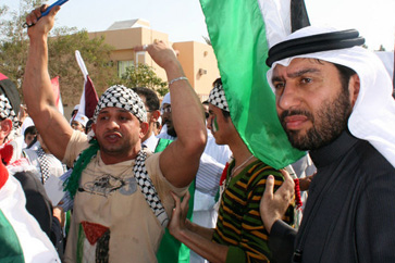 Angry protesters march in Doha