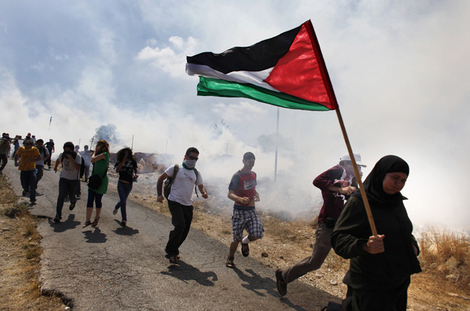 Israeli troops confront peaceful West Bank protest with tear gas