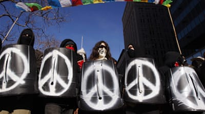 A group of Occupy Oakland demonstrators march through Downtown Oakland [Reuters]
