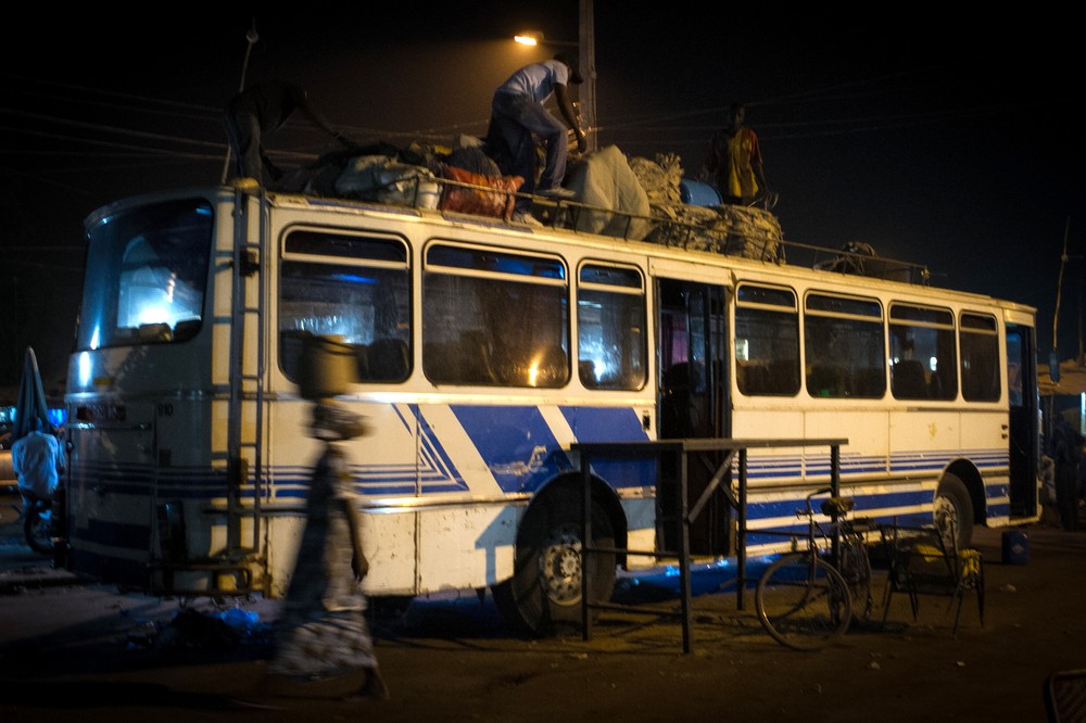 Men unload luggage from a bus arriving from Gao, a city now in the hands of rebels. Tens of thousands of people from Mali(***)s northern territories have fled and are now living in Bamako.