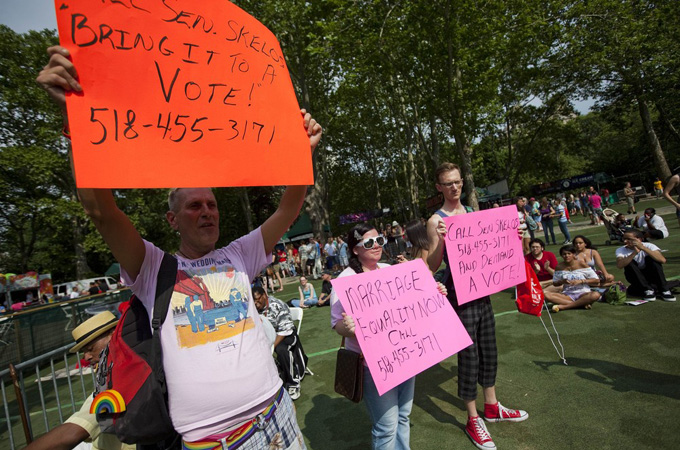 "Whether or not anyone agrees that gay and lesbian couples have a claim on the legal and social benefits of marriage, their children clearly need them, and badly," says author [Getty Images]