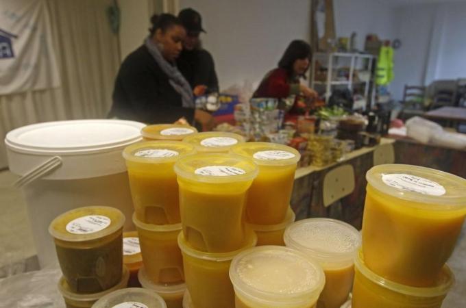 Plastic boxes with warm soup are seen at the Casa NGO in Azeitao