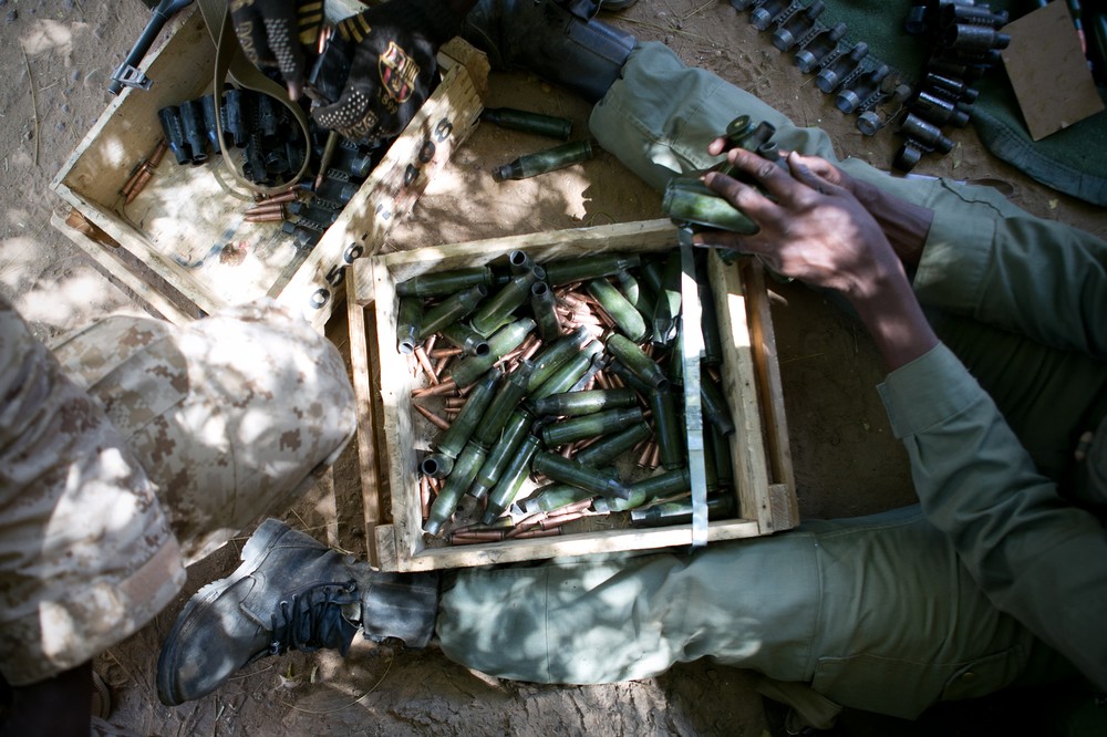 A soldier reloads his weapon during street battles between the rebels and French and Malian forces in Gao. The streets of Mali(***)s biggest northern town were paralysed by fighting after members of MUJAO took over the mayor(***)s office and city hall. 