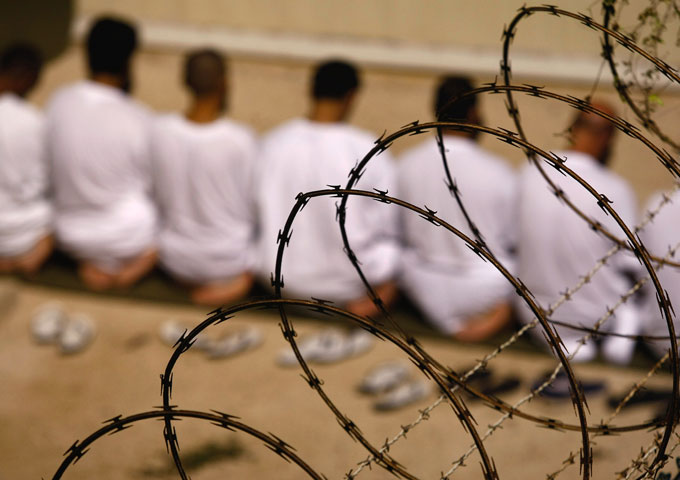 Muslim detainees pray during an early morning Islamic prayer at the US military prison for ‘enemy combatants’ in Guantanamo Bay, Cuba