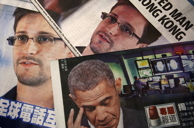 Photos of Edward Snowden, a contractor at the National Security Agency (NSA), and U.S. President Barack Obama
