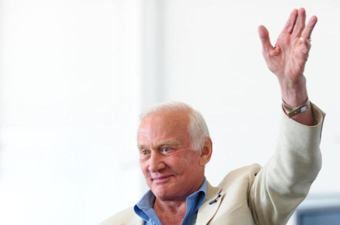 Former US Astronaut Buzz Aldrin waves to