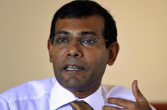 "Nasheed’s journey from a Maldivian torture cell to global statesman is the stuff movies are made of," write Lykke Friis and Anders Henriksen.  [AP]