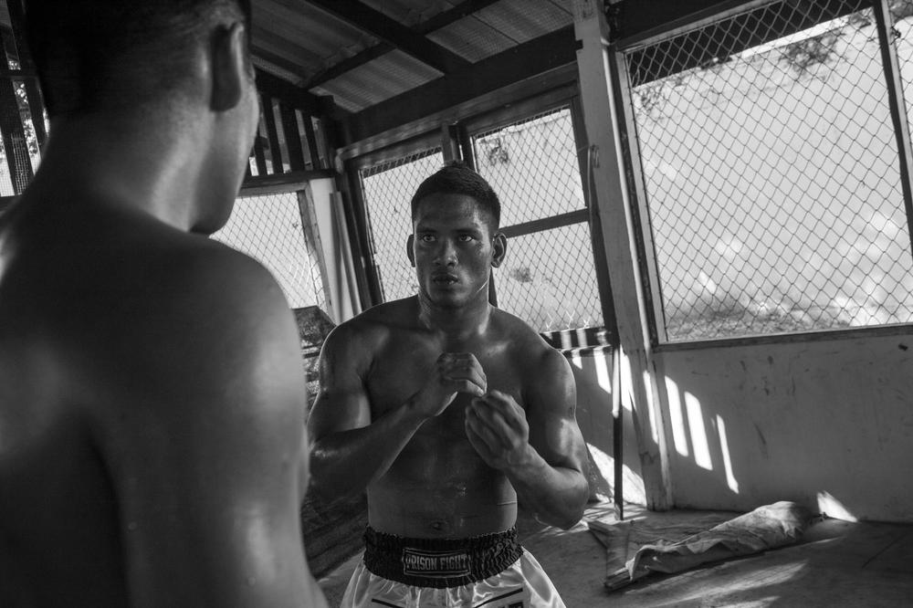 Prisoners spar in the makeshift gym of Khlong Phai prison. The history of Thai prisoners fighting for freedom dates back to the 18th century.