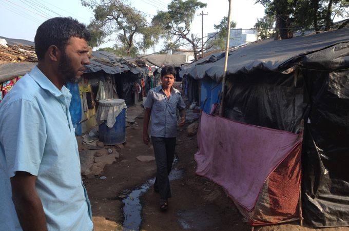 Tarpaulin sheets and open sewage greet visitors in Rohingya camps in Hyderabad [MAR Fareed/Al Jazeera]