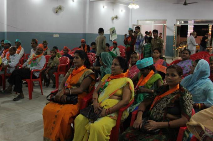 A group of locals gather at a hall in a Shia area of Lucknow to show support for the BJP [Sonia Paul/ Al Jazeera]