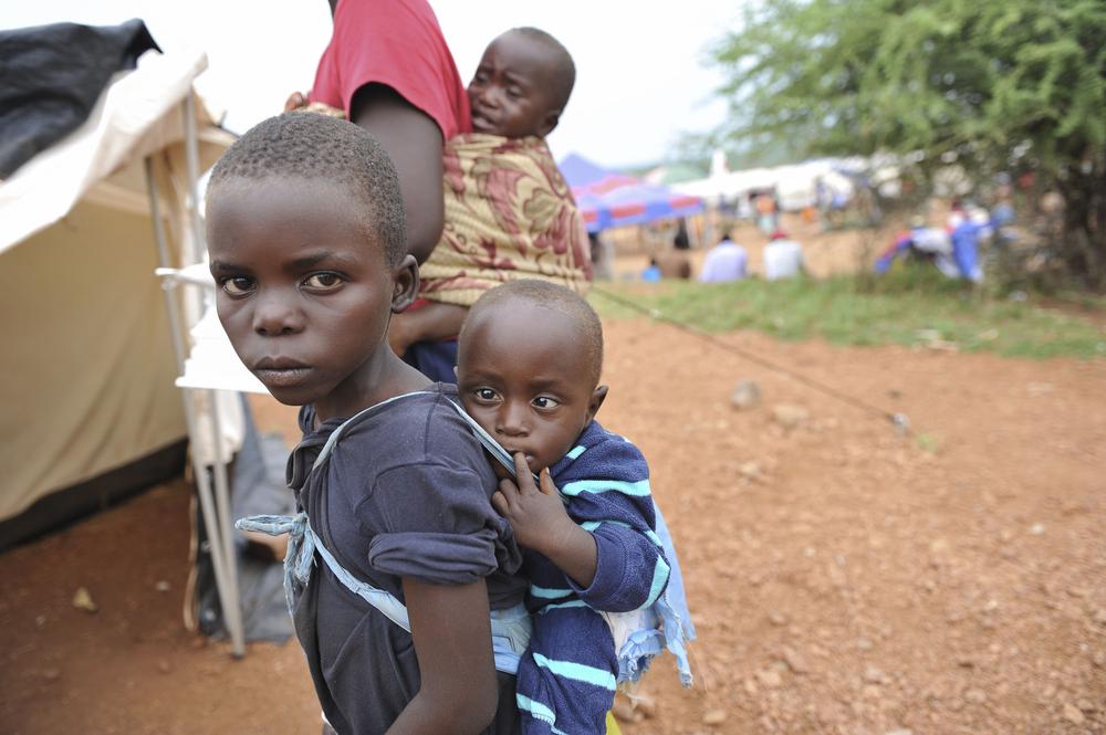 <p>Children wait for treatment outside Chingwizi camp(***)s only medical clinic, a makeshift hospital serving more than 20,000 people. </p>