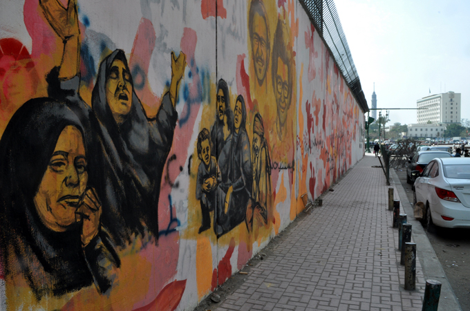 Murals frequently shift and change, with artists defacing or enhancing earlier works [Transterra/Al Jazeera]