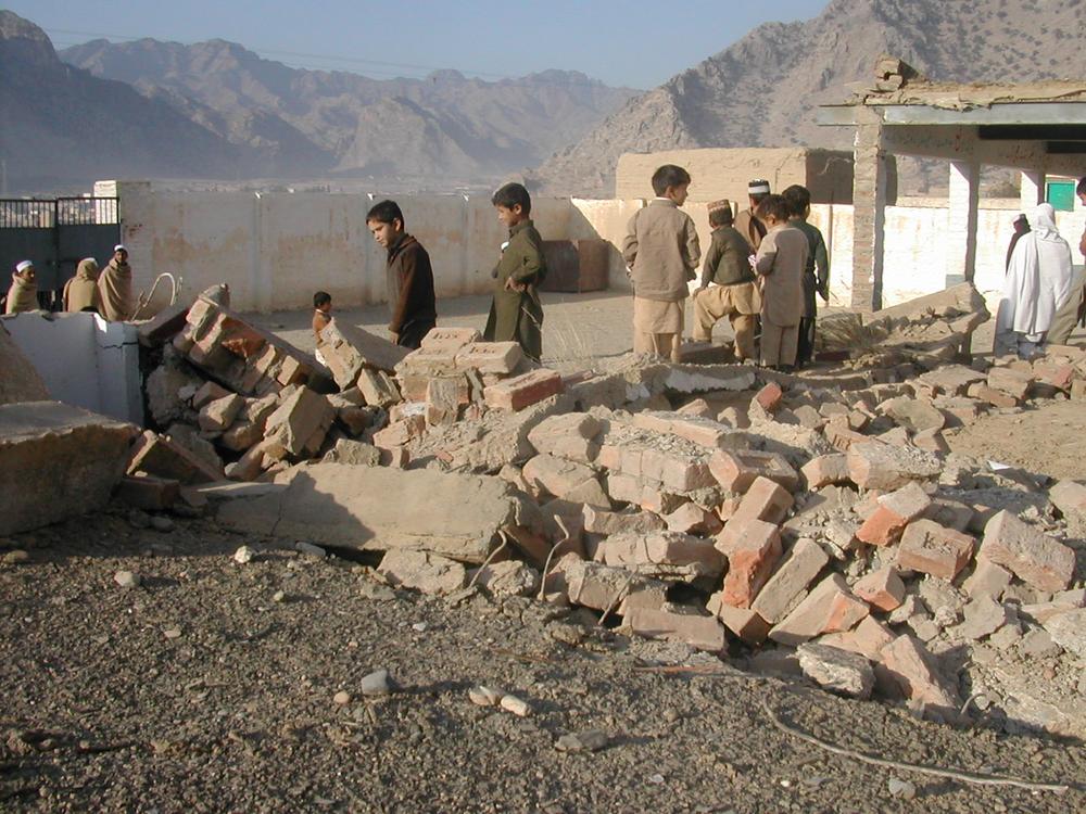 <p>Children look at the ruins of their school that was blown up by armed groups in Azam Khel village near the Torkham border crossing between Afghanistan and Pakistan. According to the federally administered tribal areas, FATA, secretariat, more than 450 educational institutions - including dozens of schools for girls - have been bombed since 2008.</p>