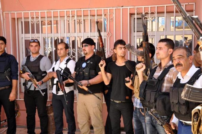 Heavily armed men gathered at the offices of the Iraqi Turkmen Front in Kirkuk [EPA]