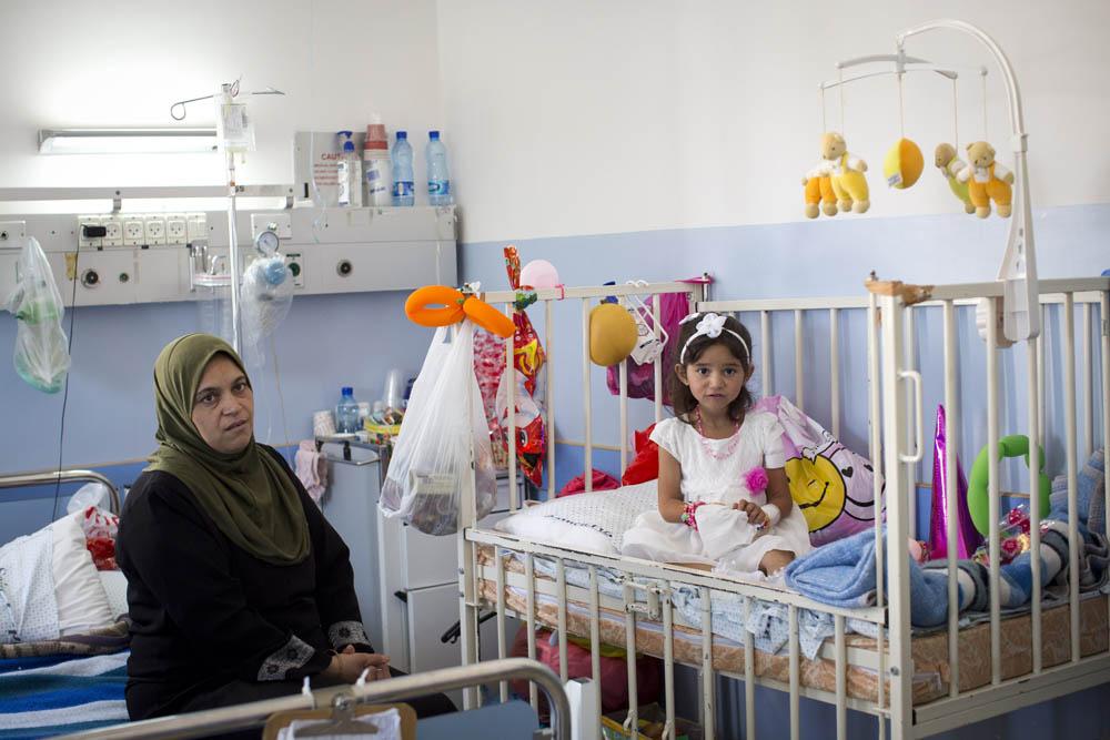 <p>Four-year-old Shymaia Ibrahim Massri from Beit Hanoun was injured on July 9 as she and her family were trying to reach a relative(***)s home. They were hit by two missiles shot from an Israeli drone. Her mother, two brothers and a cousin died on the spot; her sister died in the hospital from her wounds.</p>