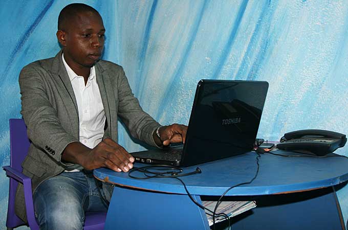 Security analyst Silvestre Moke says criminals install spyware at internet cafés [Kingsley Kobo/Al Jazeera]