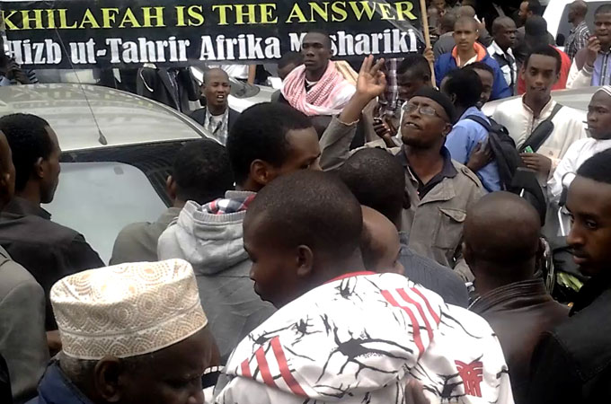 Worshipers mill around Jamia Mosque after Friday prayers [Yasin Kakande/Al Jazeera]