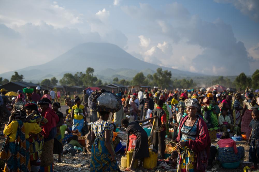 Mount Nyiragongo towers over Kanyarucinya, on the outskirts of Goma, where tens of thousands of people took refuge in August 2012, during the M23 rebellion.   