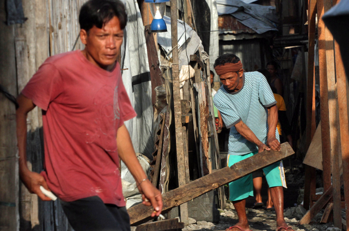 Reconstruction continues after  6,300 people were killed a year ago by super typhoon Haiyan [Jason Gutierrez]