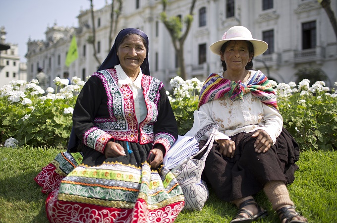 Melchora Surco Remachi and Faustina Nununcca travelled from Cusco to attend the rally [Danielle Villasana/Al Jazeera]