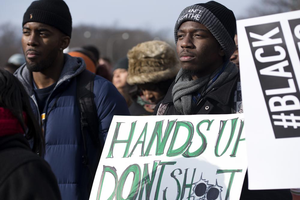 <p>Protesters gather Saturday morning at Freedom Plaza, chanting and listening to speakers before marching to the Capitol Building.</p>