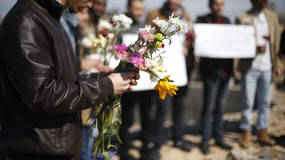 Palestinians gather to remember the Chapel Hill shooting victims, the three young Muslims who were gunned down in North Carolina this week, in Gaza City