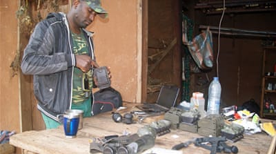 Forest ranger Jude Viban and a team of volunteers have been tracking rare chimps for years [Eugene Nforngwa/Al Jazeera]