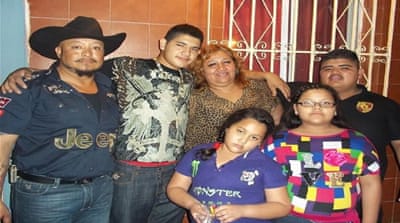 From left: Juan Manuel Lopez [father], unidentified family friend, Sonia Loredo, missing Julio Cesar Martinez Loredo, and Luisa and Mary [Al Jazeera]