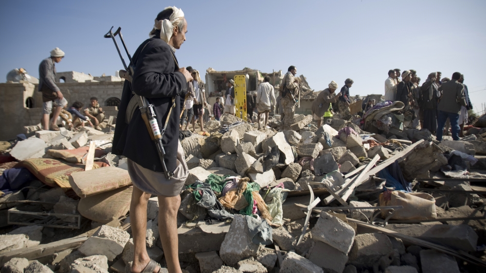 People search for survivors after coalition air strike near Sanaa, Yemen