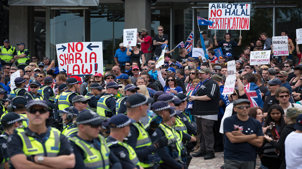 Posters showed what many Australians in the anti-Islam rally feared [Snehargho Ghosh/Al Jazeera]