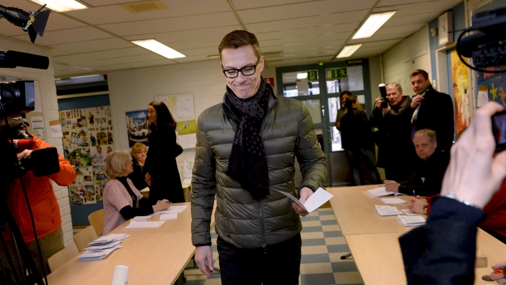 Finnish Prime Minister and leader of National Coalition Party Alexander Stubb casts his vote during the parliamentary election in Espoo