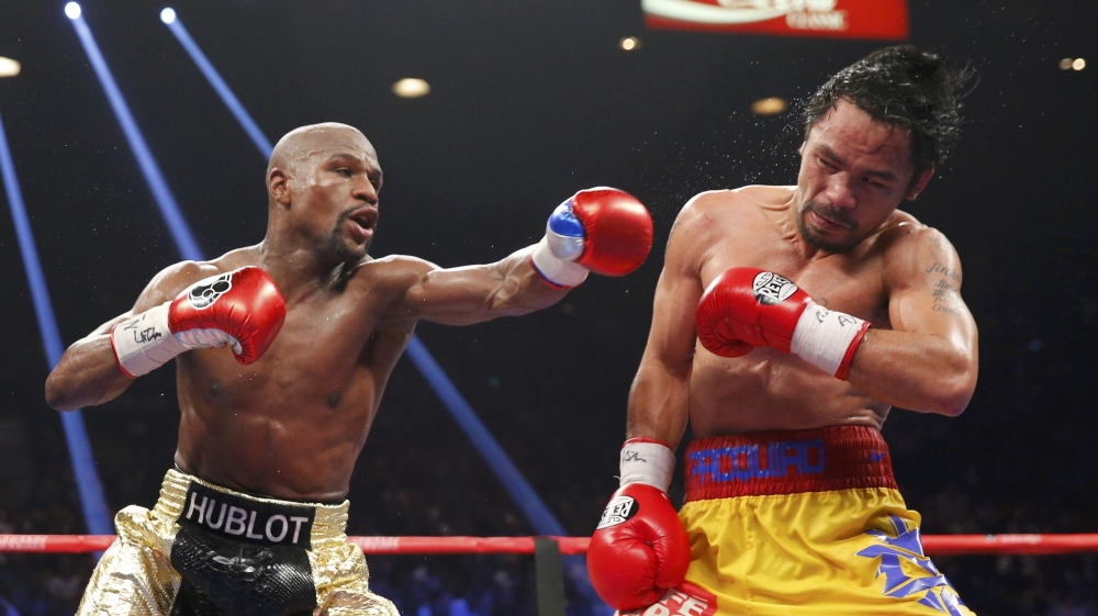 Mayweather, Jr. of the U.S. lands a left to the face of Pacquiao of the Philippines in the 11th round during their welterweight title fight in Las Vegas