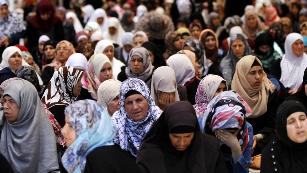 Palestinian worshipers pray outside the al-Aqsa mosque