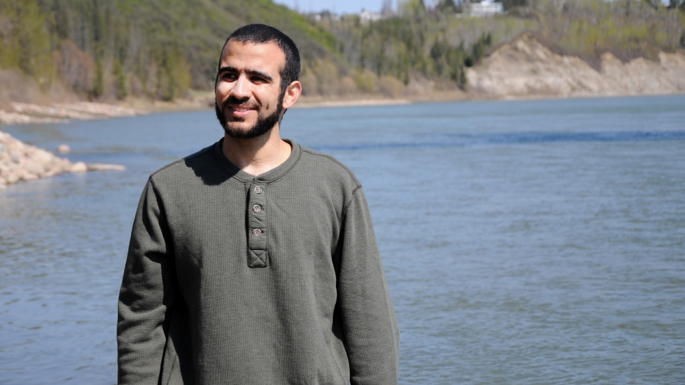 Omar Khadr stops near the North Saskatchewan river during his first long walk and bike ride after being freed after having spent nearly half of his life in custody [Getty]