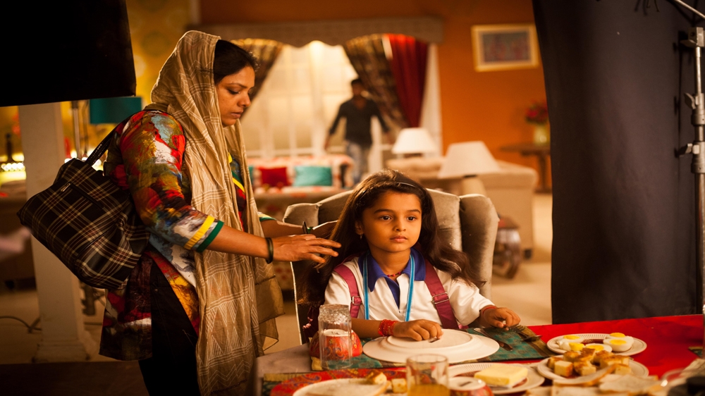 Six-year-old Spandan Chaturvedi gets her hair done by a make-up artist. She plays the lead role in the TV show  Udaan  , in which she portrays a bonded labourer [Karen Dias]