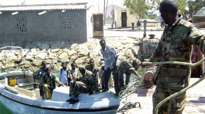 A member of the Somaliland coastguard ties up a boat in Berbera [AP]