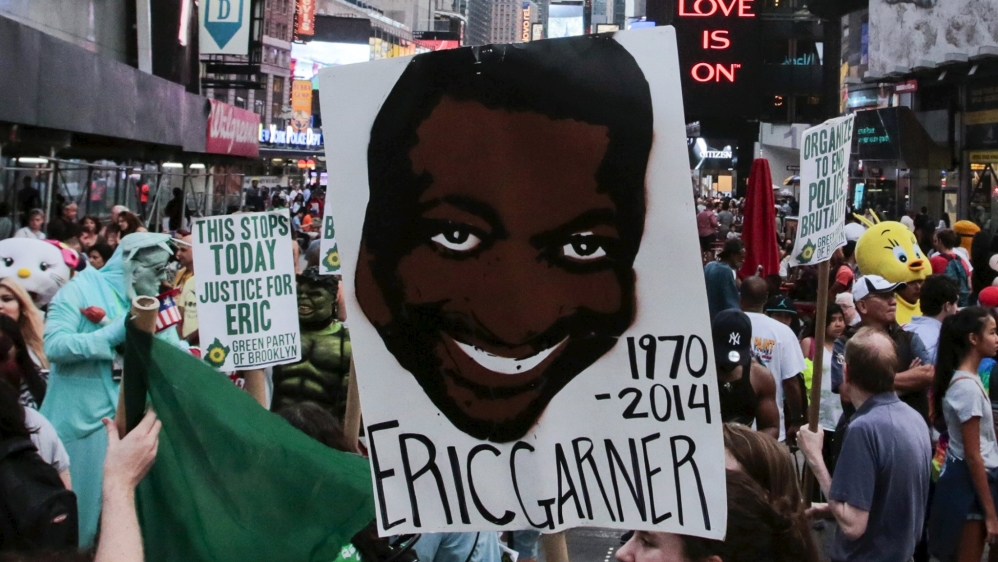 Protesters march through Times Square for Eric Garner's anniversary 