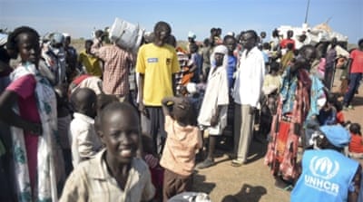 Newly-arrived displaced people register to receive food and other aid at the UN base in Bentiu, South Sudan [AP]