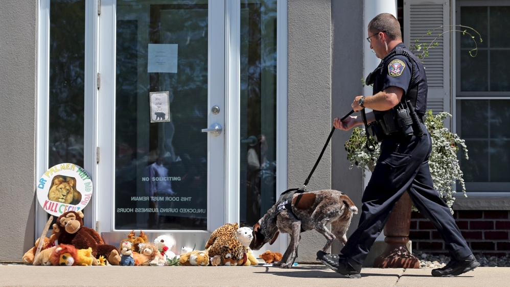 Police were in attendance at protests outside Palmer's clinic, where protesters left stuffed animals [Reuters]