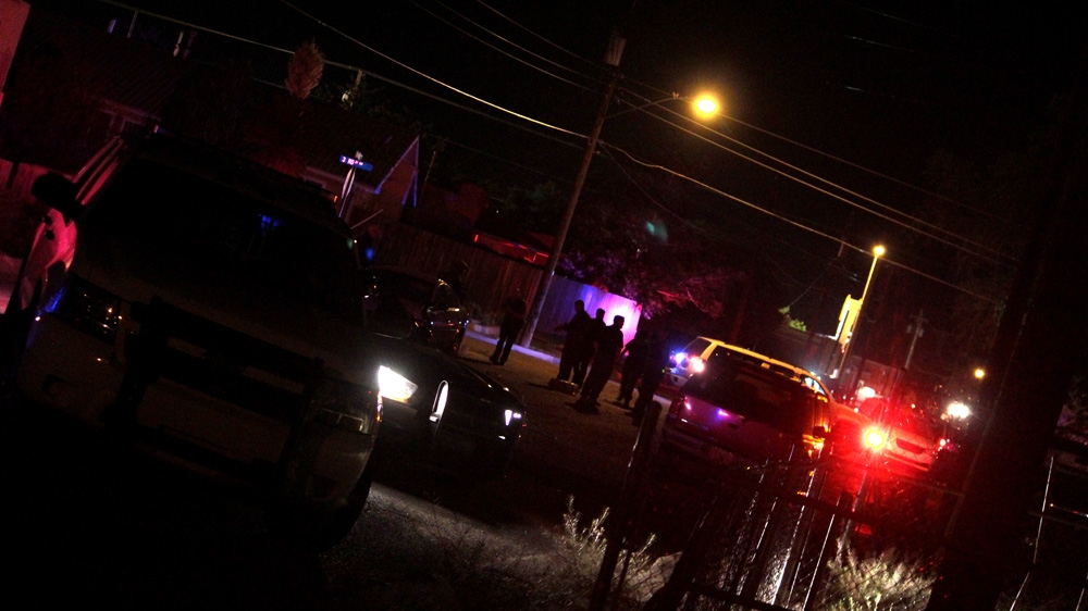Police debrief in the streets of Albuquerque following a SWAT standoff in May 2015 [Andy Beale/Al Jazeera]
