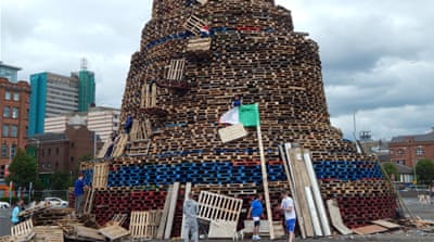 Sandy Row bonfire preparations in Central Belfast [Molly McCluskey/Al Jazeera]