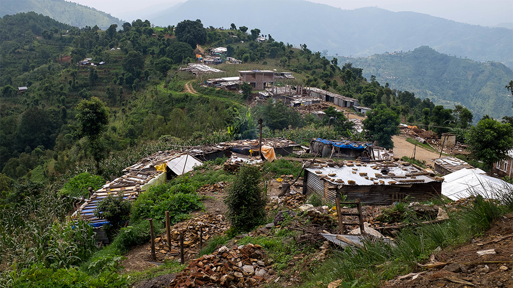 Many people are demolishing their earthquake-damaged homes on their own, using handheld tools [Juliette Rousselot/Al Jazeera]