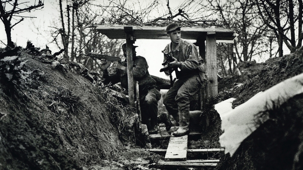 Bosnian Muslim fighters come under fire in the former Yugoslavia. It was trench warfare and this was a frontline. But what was particularly unsettling was that the bullets were coming from behind us as well as from in front. We had been flanked. 1994 [Jack Picone] 