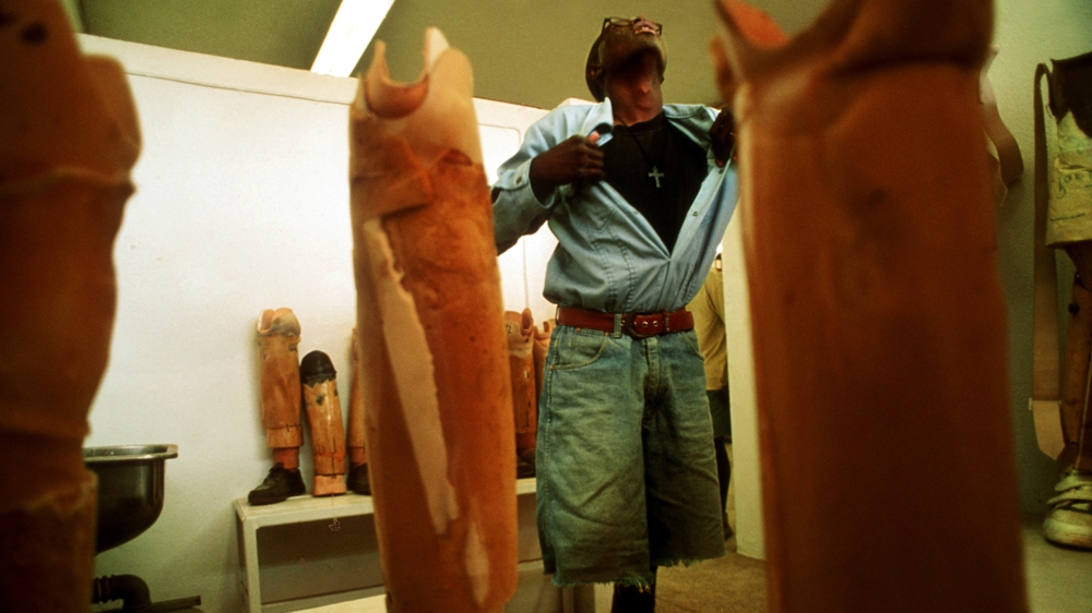 An Angolan landmine victim experiences a 'phantom pain' in his amputated limb. I had waited in the prosthetics room knowing that an amputee would come in. He reeled back in pain as though he had been electrocuted, pulling his shirt open as he tried to maintain his balance. 1994 [Jack Picone] 