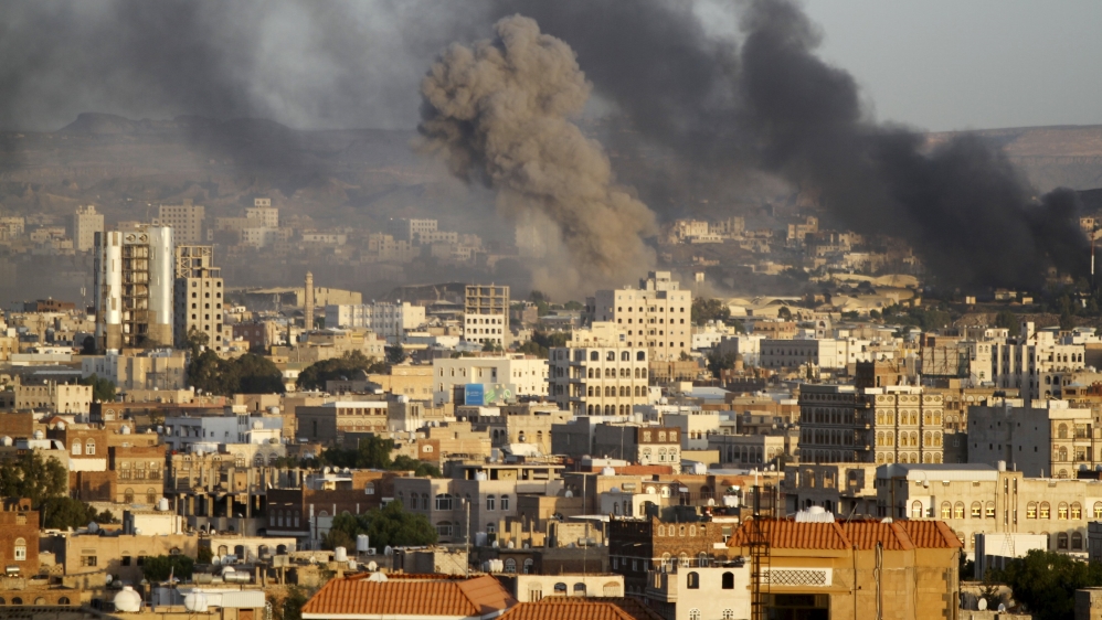 Smoke billows from a Houthi-controlled military base