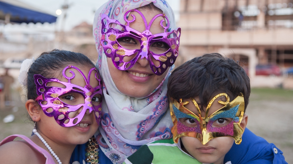 Ameera with her two children, Layan and Adam, at a birthday party at the beach [Edmee van Rijn]