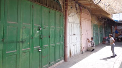 Hebron's Old City looks like a ghost town, with many stores forced to close following Israeli military orders and Palestinians living in fear of the settlers [Mel Frykberg/Al Jazeera]